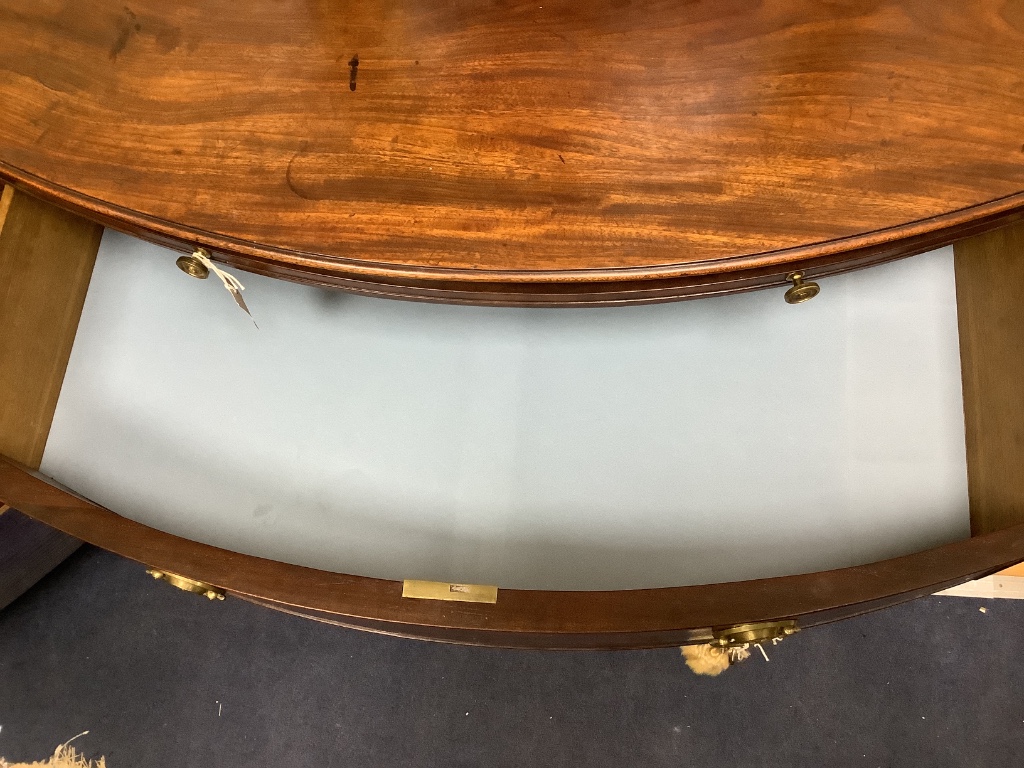 A late Georgian bow-fronted mahogany chest with brushing slide, width 94cm, depth 54cm, height 88cm